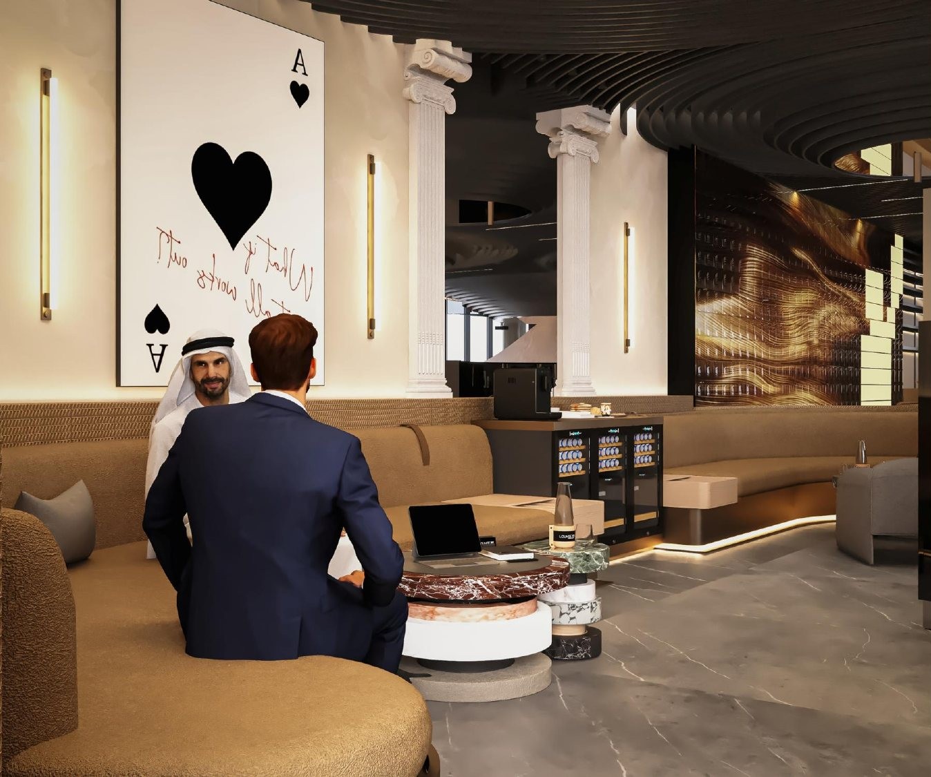 Two executives in conversation on a curved leather sofa beneath the Ace of Spades artwork
