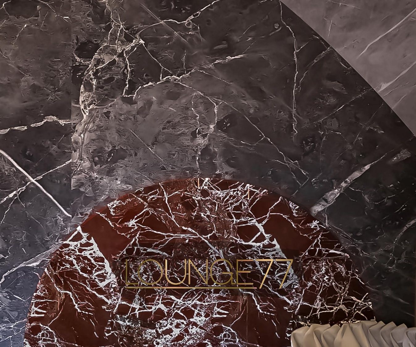 LOUNGE77 inlaid in the red marble floor